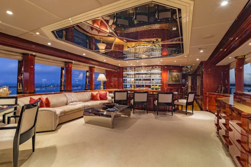 Slide: The Image of Luxurious interior of 2002 Christensen Trideck yacht with elegant seating and mirrored ceiling. - 38