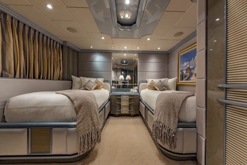 Slide: The Image of Luxurious twin bedroom on 2002 Christensen Trideck yacht, featuring elegant decor and cozy bedding. - 30