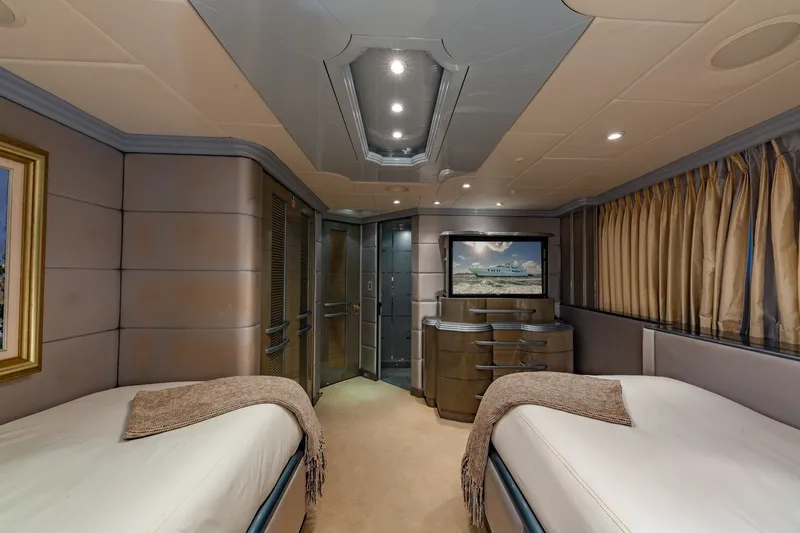 Slide: The Image of Luxurious twin bedroom on 2002 Christensen Trideck yacht with elegant decor and modern amenities. - 31