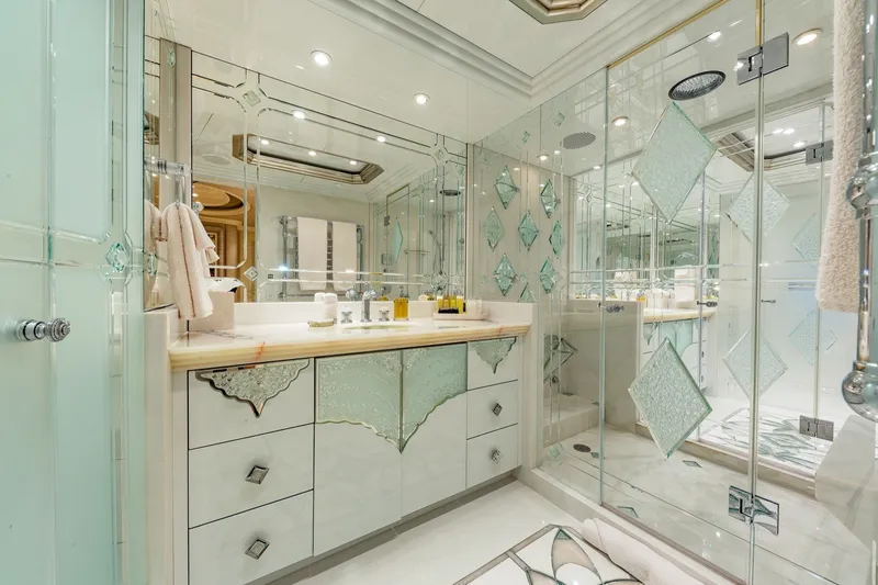 Slide: The Image of Luxurious yacht bathroom with elegant glass decor, mirrored walls, and modern fixtures on Christensen Trideck 2002. - 20