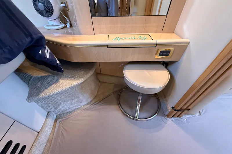 Slide: The Image of Interior of 2002 Sea Ray Sundancer 460 yacht with vanity area and stool. - 53