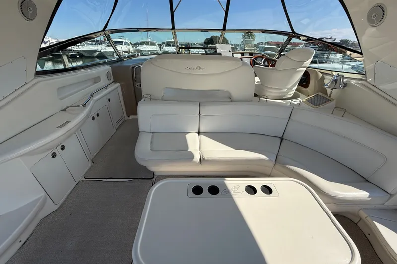 Slide: The Image of Luxurious interior of 2002 Sea Ray Sundancer 460 yacht with plush seating and helm. - 18