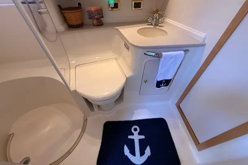 Slide: The Image of Bathroom interior of 2002 Sea Ray Sundancer 460 yacht, featuring nautical-themed decor. - 59