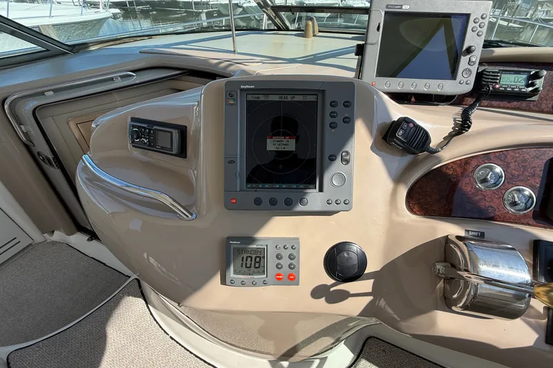 Slide: The Image of Helm of 2002 Sea Ray Sundancer 460 with navigation equipment and controls. - 31