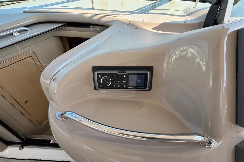Slide: The Image of Control panel on a 2002 Sea Ray Sundancer 460 yacht, featuring a Fusion stereo system. - 38