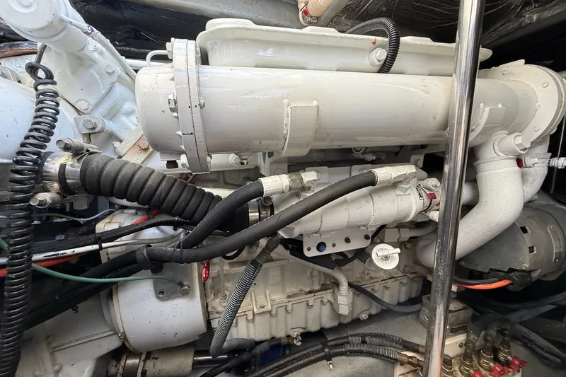 Slide: The Image of Engine compartment of a 2002 Sea Ray Sundancer 460 yacht, showcasing mechanical components. - 80