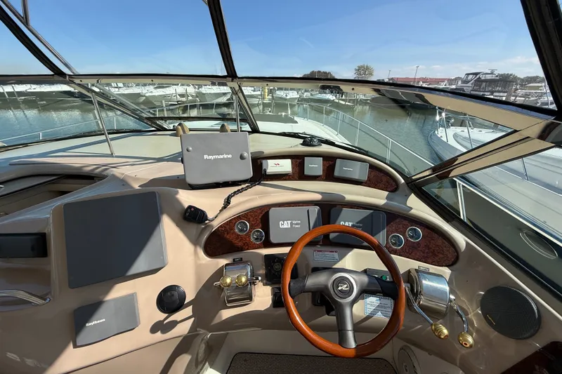 Slide: The Image of Cockpit view of 2002 Sea Ray Sundancer 460 yacht with Raymarine navigation system. - 30