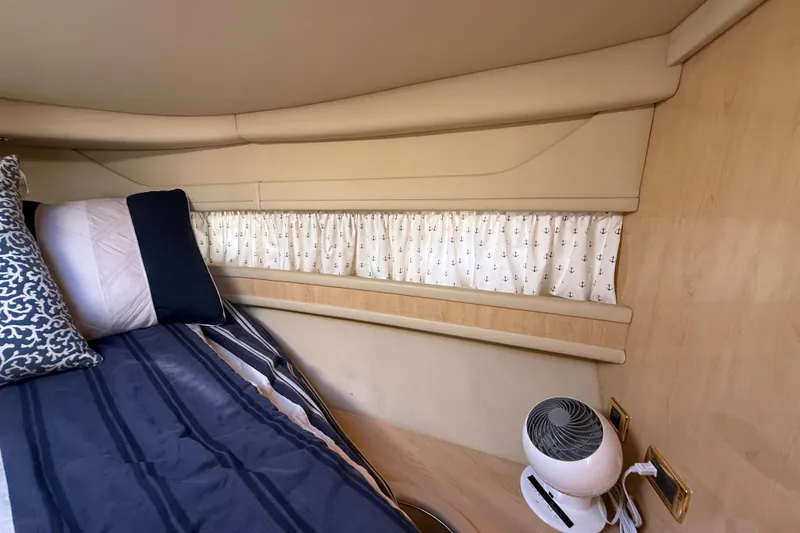 Slide: The Image of Interior cabin of 2002 Sea Ray Sundancer 460 with cozy bedding and nautical decor. - 54