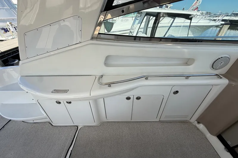 Slide: The Image of Interior view of a 2002 Sea Ray Sundancer 460 yacht, featuring sleek cabinetry and a window. - 23