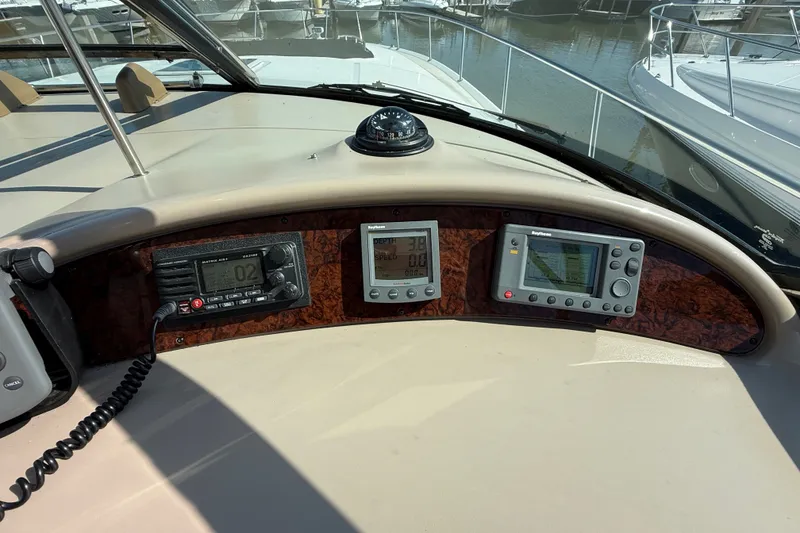 Slide: The Image of Control panel of a 2002 Sea Ray Sundancer 460 yacht with navigation instruments. - 33