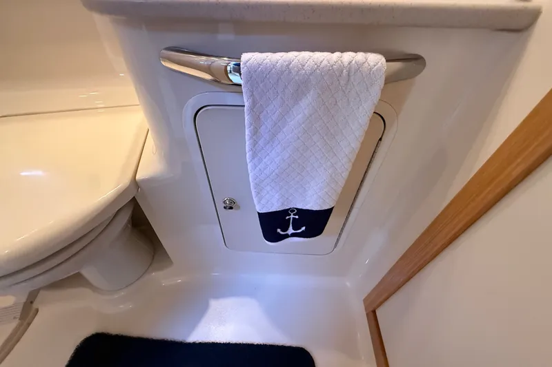 Slide: The Image of Bathroom interior of 2002 Sea Ray Sundancer 460 yacht with anchor-themed towel. - 61