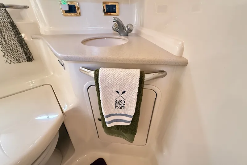 Slide: The Image of Bathroom interior of 2002 Sea Ray Sundancer 460 yacht with sink and towel. - 72