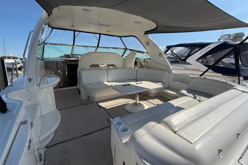Slide: The Image of Luxurious 2002 Sea Ray Sundancer 460 yacht interior with spacious seating and table. - 13