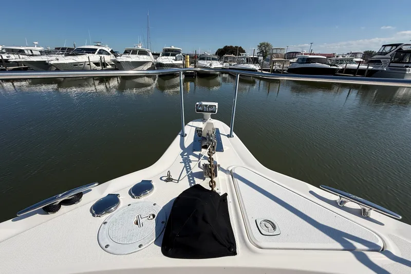 Slide: The Image of Bow view of 2002 Sea Ray Sundancer 460 yacht docked in marina. - 10