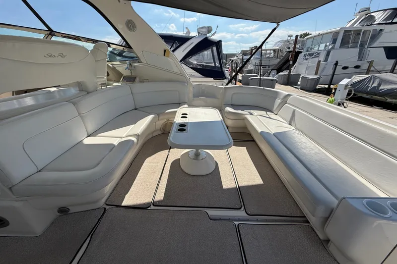 Slide: The Image of Luxurious 2002 Sea Ray Sundancer 460 yacht interior with spacious seating and table. - 14