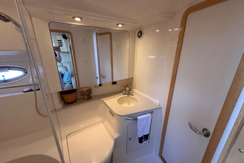 Slide: The Image of Luxurious bathroom in 2002 Sea Ray Sundancer 460 yacht with modern fixtures and elegant design. - 58