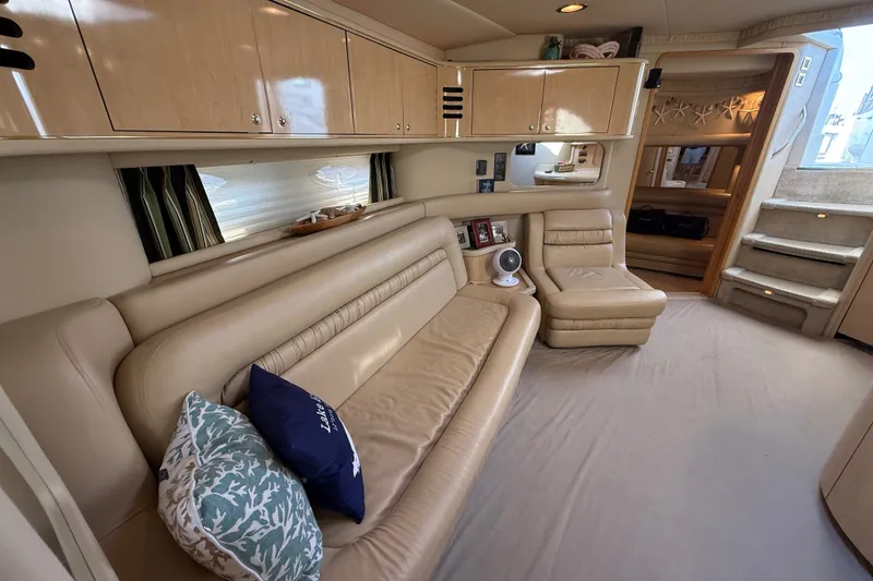 Slide: The Image of Luxurious interior of a 2002 Sea Ray Sundancer 460 yacht with beige leather seating. - 49