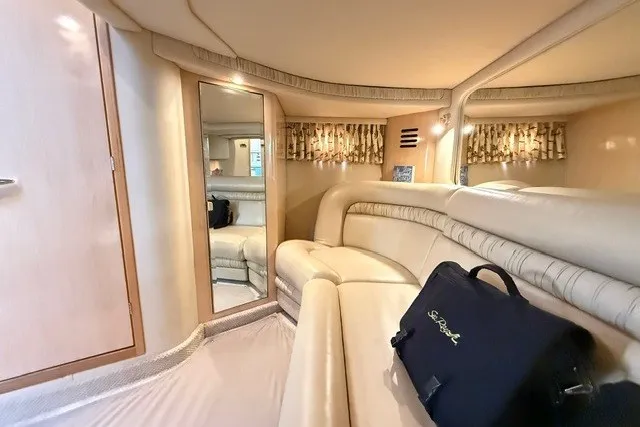 Slide: The Image of Luxurious interior of 2002 Sea Ray Sundancer 460 yacht with beige seating and elegant decor. - 67