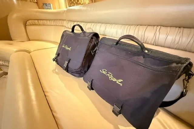 Slide: The Image of Sea Ray Sundancer 460 bags on a beige leather boat interior, 2002 model. - 68