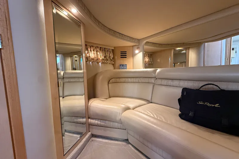 Slide: The Image of Luxurious interior of 2002 Sea Ray Sundancer 460 yacht with beige leather seating. - 66