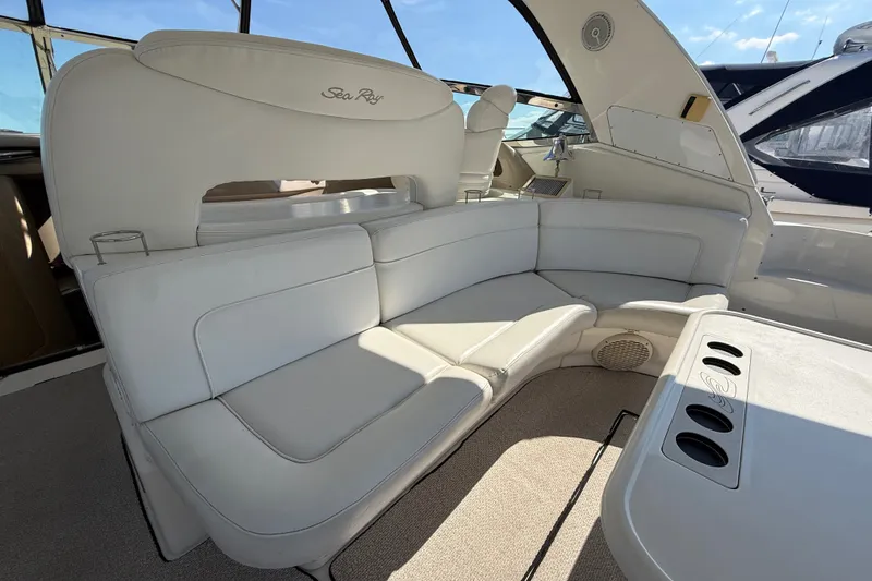 Slide: The Image of Luxurious interior of 2002 Sea Ray Sundancer 460 yacht with plush seating and table. - 16