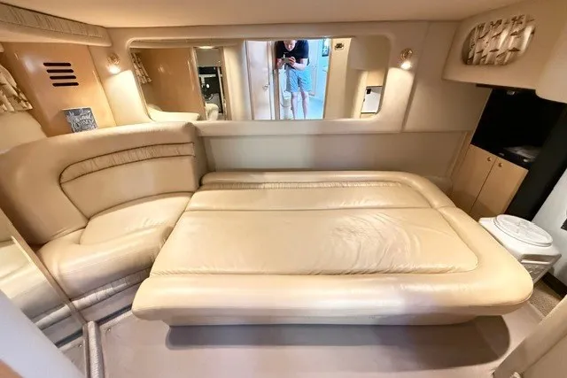 Slide: The Image of Interior cabin of 2002 Sea Ray Sundancer 460 yacht with beige leather seating. - 69