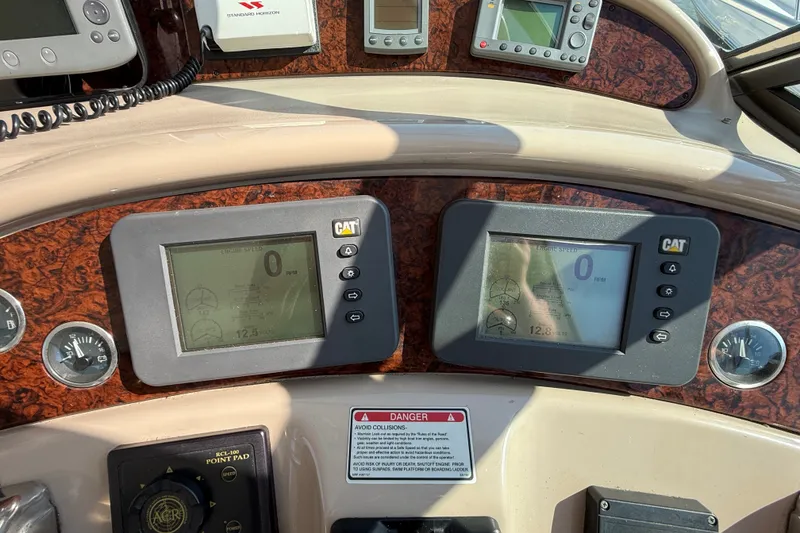 Slide: The Image of Control panel of a 2002 Sea Ray Sundancer 460 yacht with digital displays. - 35