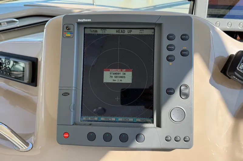 Slide: The Image of Raytheon marine navigation display on 2002 Sea Ray Sundancer 460 yacht dashboard. - 32