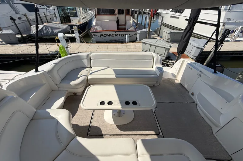 Slide: The Image of Luxurious seating area on a 2002 Sea Ray Sundancer 460 yacht at a marina. - 24