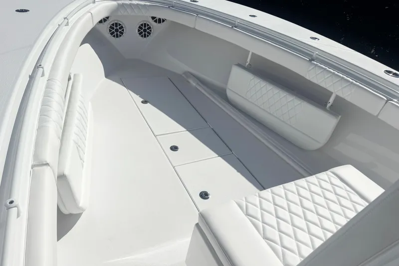 Slide: The Image of 2026 Onslow Bay 33 Tournament Edition boat interior with white cushioned seating. - 11