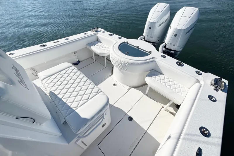 Slide: The Image of 2026 Onslow Bay 33 Tournament Edition boat with dual engines and luxurious seating. - 12