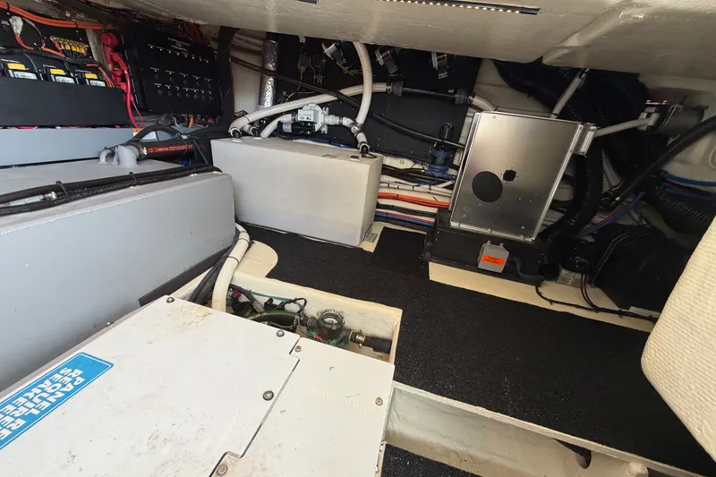 Slide: The Image of Engine room of 2023 Regal 38 XO yacht, showcasing electrical systems and components. - 32