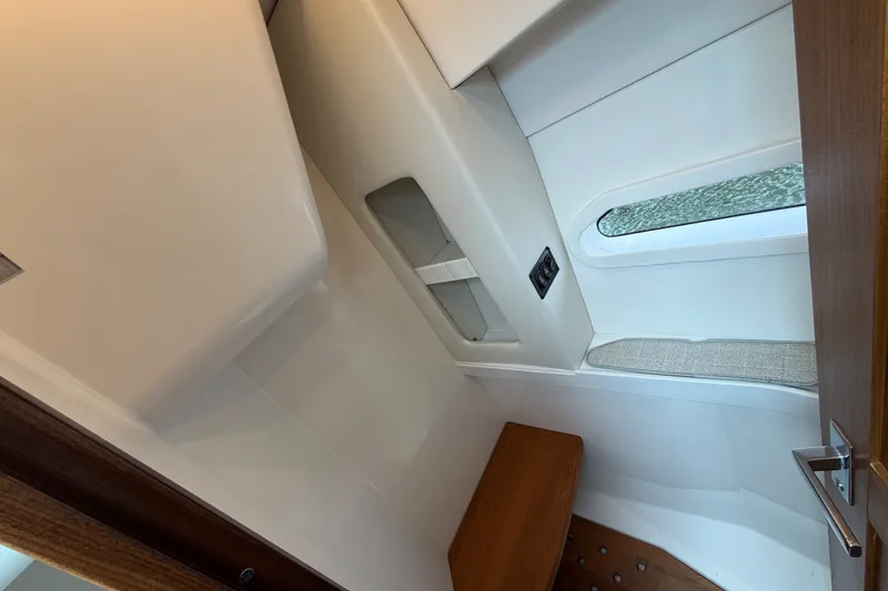 Slide: The Image of Interior cabin of 2023 Regal 38 XO yacht, featuring sleek design and modern amenities. - 29
