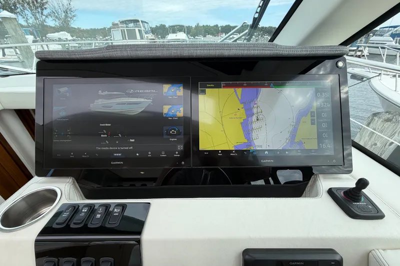 Slide: The Image of Dashboard of 2023 Regal 38 XO boat with dual Garmin navigation screens. - 17