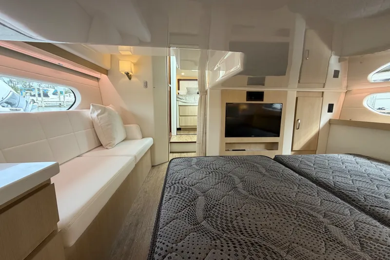 Slide: The Image of Luxurious interior of 2023 Regal 38 XO yacht with modern furnishings and cozy seating. - 25