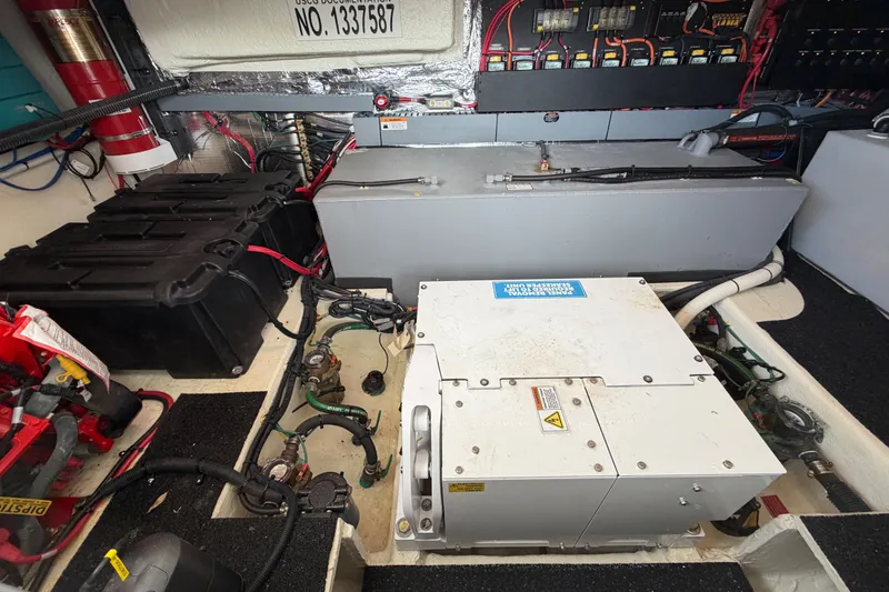 Slide: The Image of Engine compartment of 2023 Regal 38 XO boat, showcasing electrical systems and components. - 31