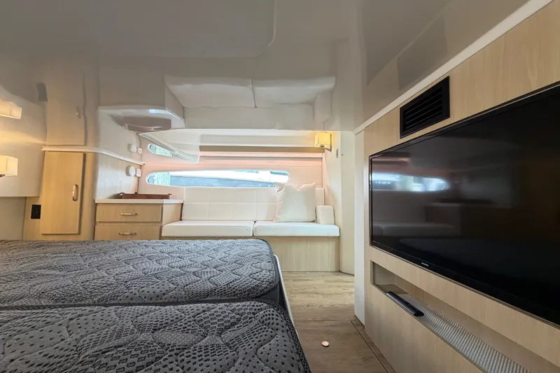 Slide: The Image of Luxurious interior of 2023 Regal 38 XO yacht with modern furnishings and large TV. - 26