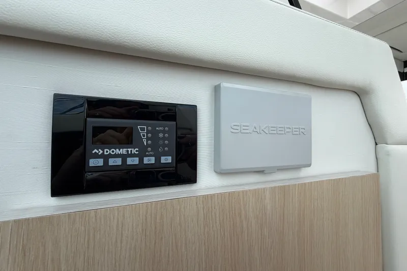 Slide: The Image of Control panel and Seakeeper system on 2023 Regal 38 XO yacht interior. - 30