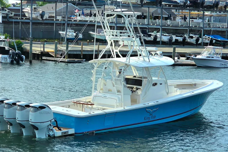 Slide: The Image of 2016 Regulator 41 boat with four engines docked in a marina. - 7
