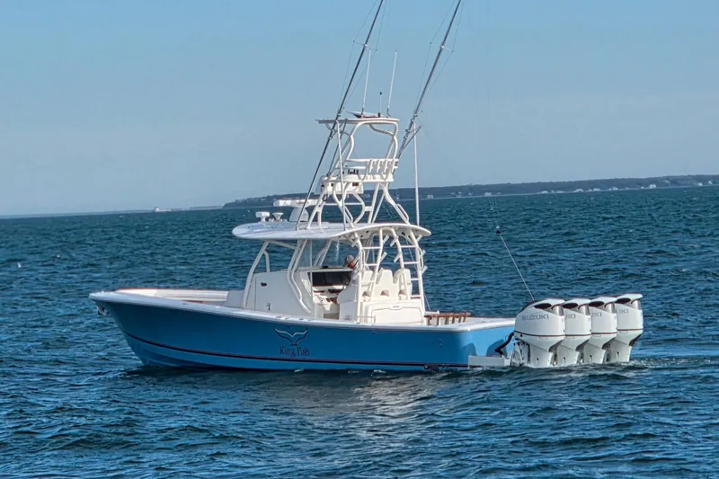 Slide: The Image of 2016 Regulator 41 boat with four Suzuki outboard engines on open water. - 5