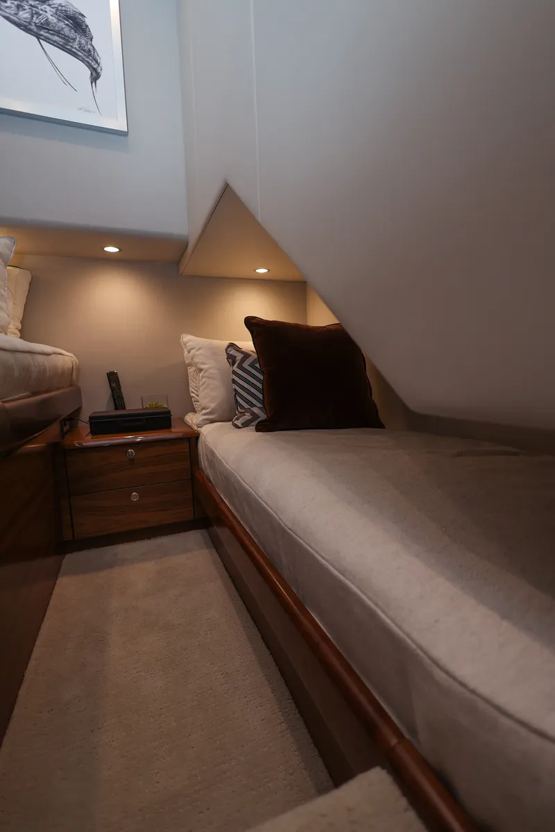 Slide: The Image of A cozy cabin bed with soft pillows and ambient lighting in a modern boat. - 50