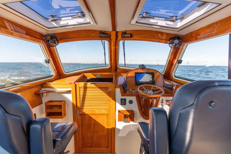 Slide: The Image of Interior of 2006 Hinckley Picnic Boat 36 EP with ocean view through windows. - 25