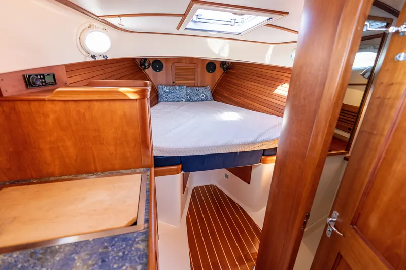 Slide: The Image of Luxurious cabin interior of 2006 Hinckley Picnic Boat 36 EP with wood finish. - 40