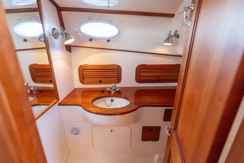 Slide: The Image of Luxurious wooden bathroom interior of 2006 Hinckley Picnic Boat 36 EP. - 44