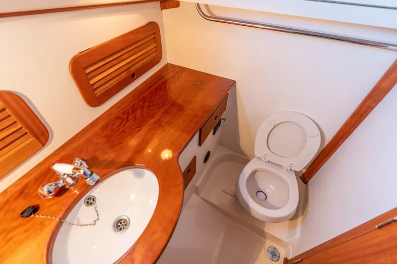 Slide: The Image of Luxurious bathroom in 2006 Hinckley Picnic Boat 36 EP with wooden accents. - 45