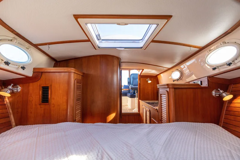 Slide: The Image of Interior of 2006 Hinckley Picnic Boat 36 EP with wooden cabinetry and portholes. - 43