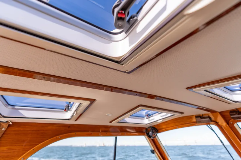 Slide: The Image of Interior view of 2006 Hinckley Picnic Boat 36 EP with skylights and wooden trim. - 31