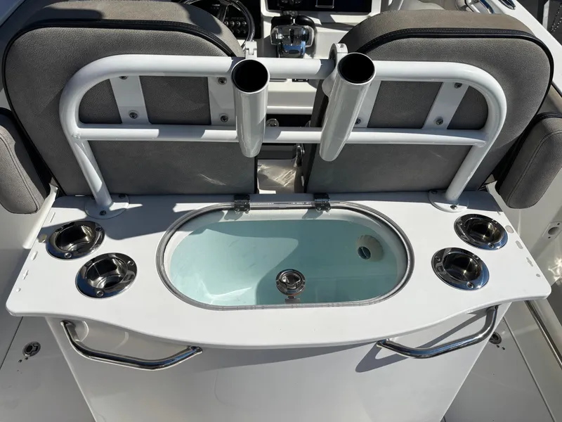 Slide: The Image of The image shows a boat with an integrated fishing rod holder and a round water basin. - 13