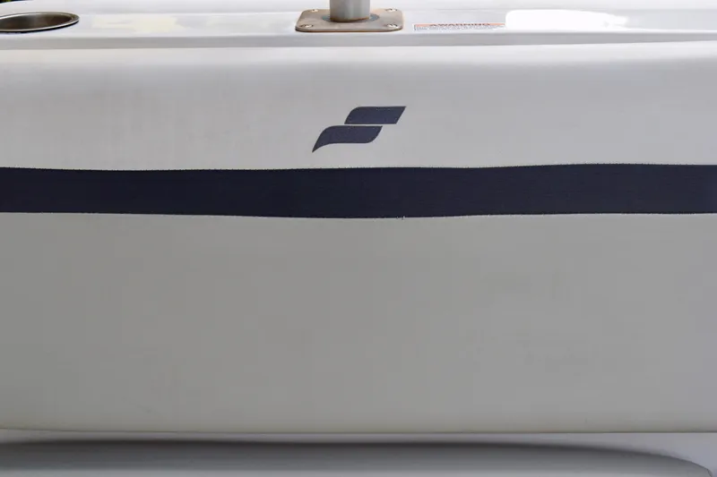 Slide: The Image of 2024 Starcraft SVX 231 OB DH boat detail with sleek design and logo. - 12