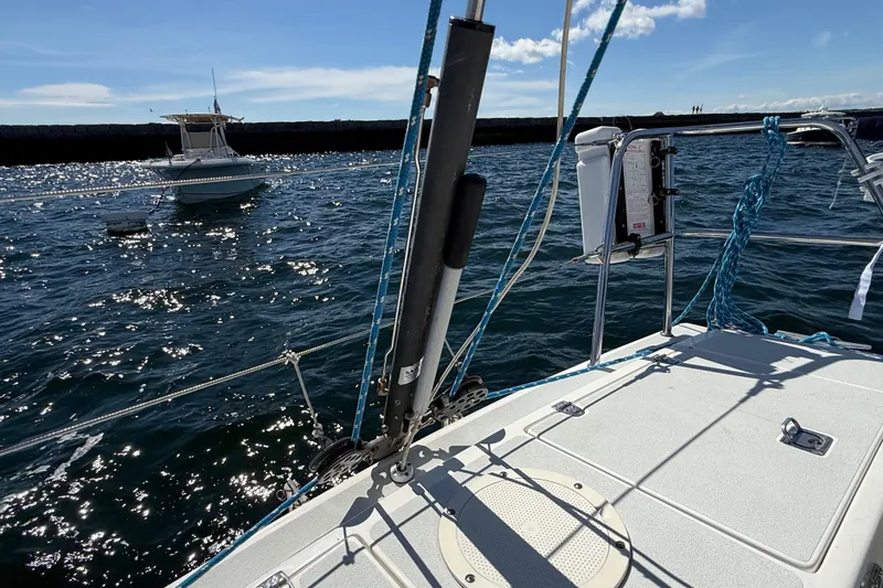 Slide: The Image of Sailing on a 1994 J Boats J/120, with a view of the ocean and another boat. - 69